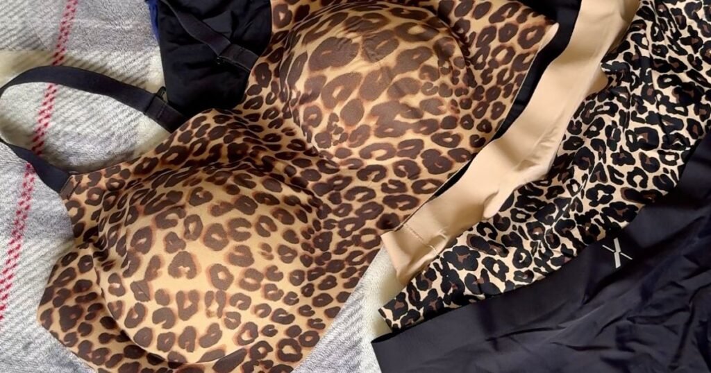 Knix Review Cover Image - shows a flatlay of a Knix bra in leopard print and some knix underwear nicely laid out on a blanket