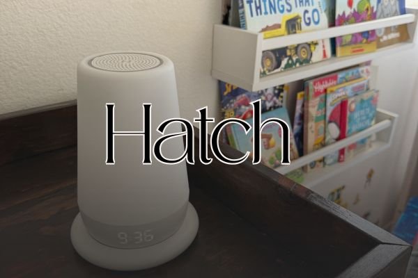 Hatch sound machine on a kids shelf in front of books with text overlay that says "Hatch"