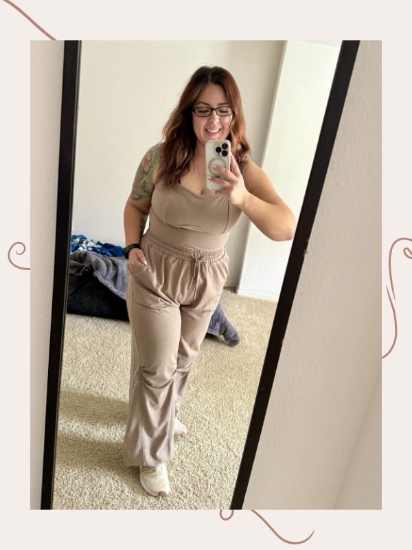 mirror selfie of woman wearing a tan jumpsuit loungewear outfit with sneakers (image for Loungewear for Moms article)