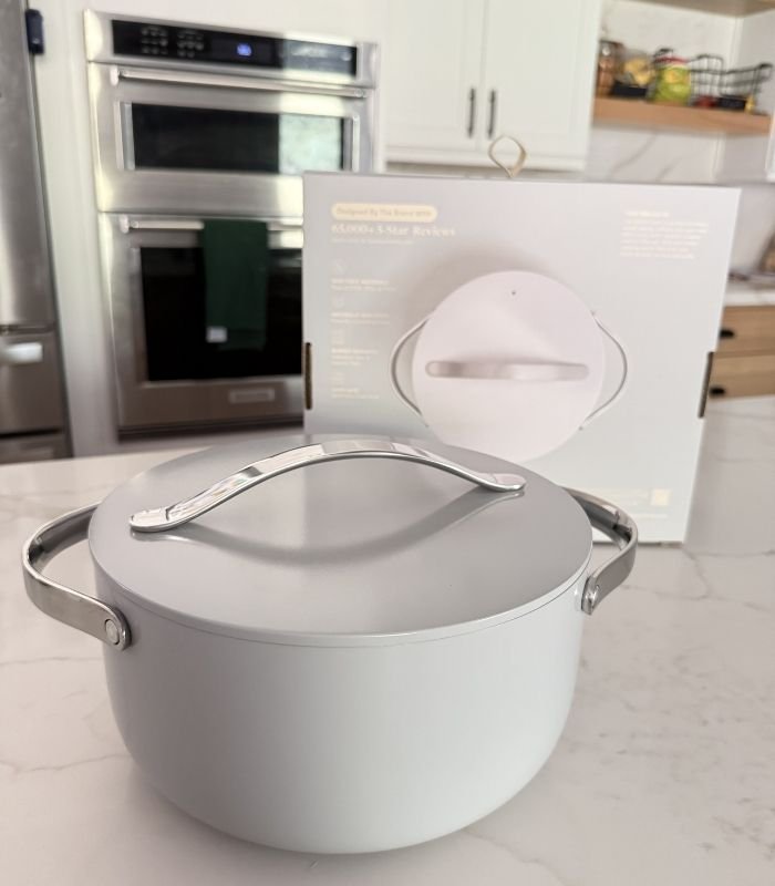 Image of Caraway ceramic dutch oven on a kitchen counter in a luxury kitchen