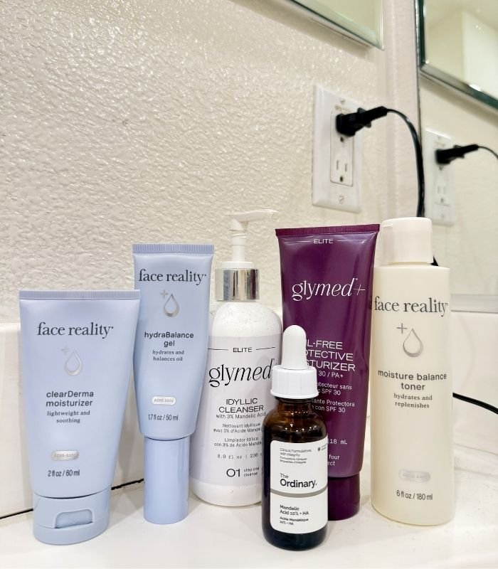 Glymed skincare products on bathroom counter